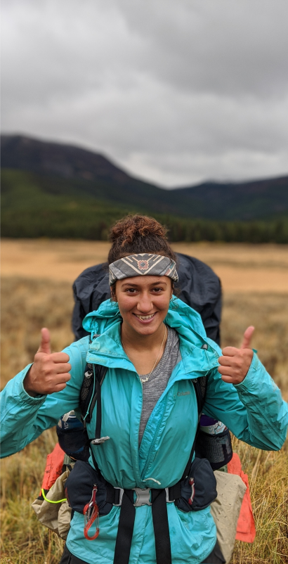 Traveler with backpack giving two thumbs up