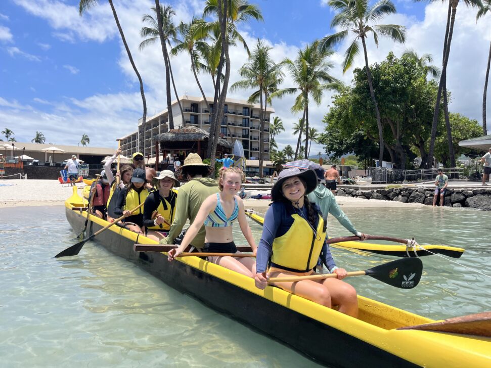 group in traditional canoe in hawaii
