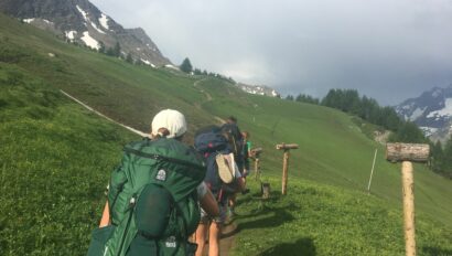 Hiking in grassy hills in the alps