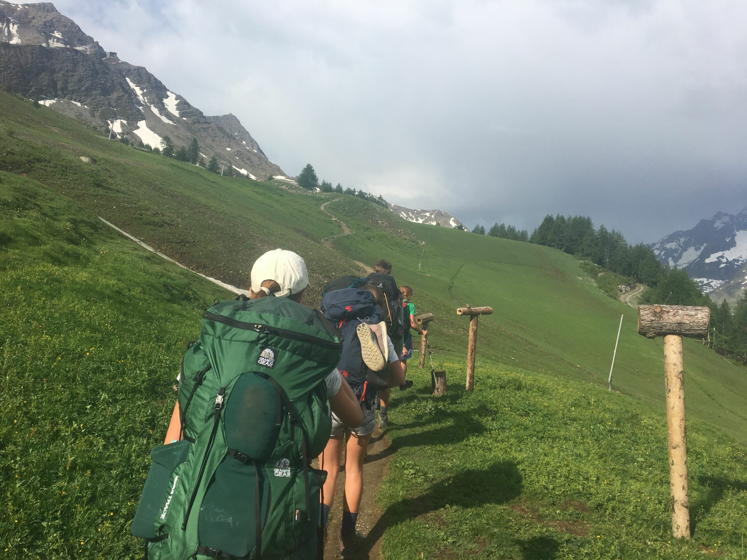 Hiking in grassy hills in the alps