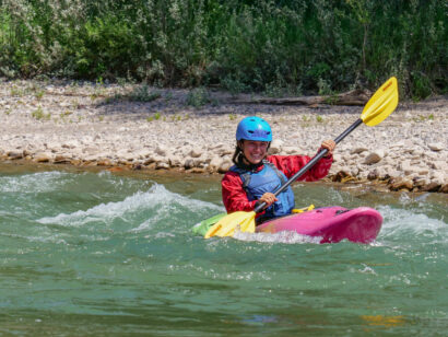 smiles while whitewater kayaking on the snake river
