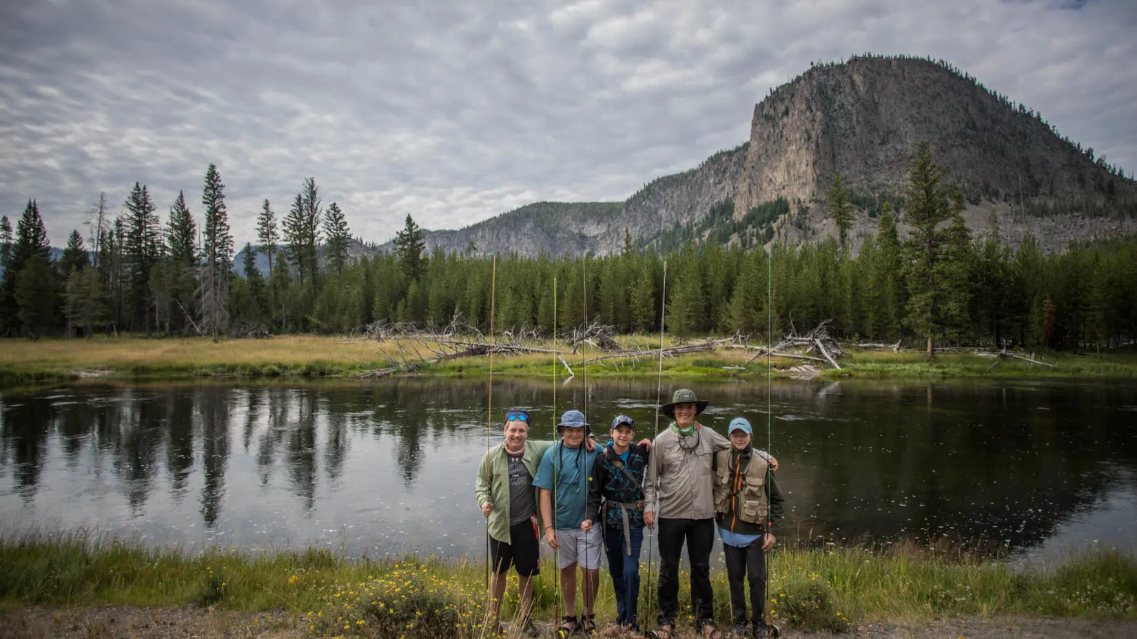 Group of travelers by a lake in Yosemite