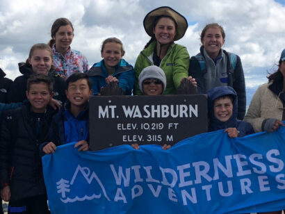 Yellowstone Teton Discovery group photo with WA flag