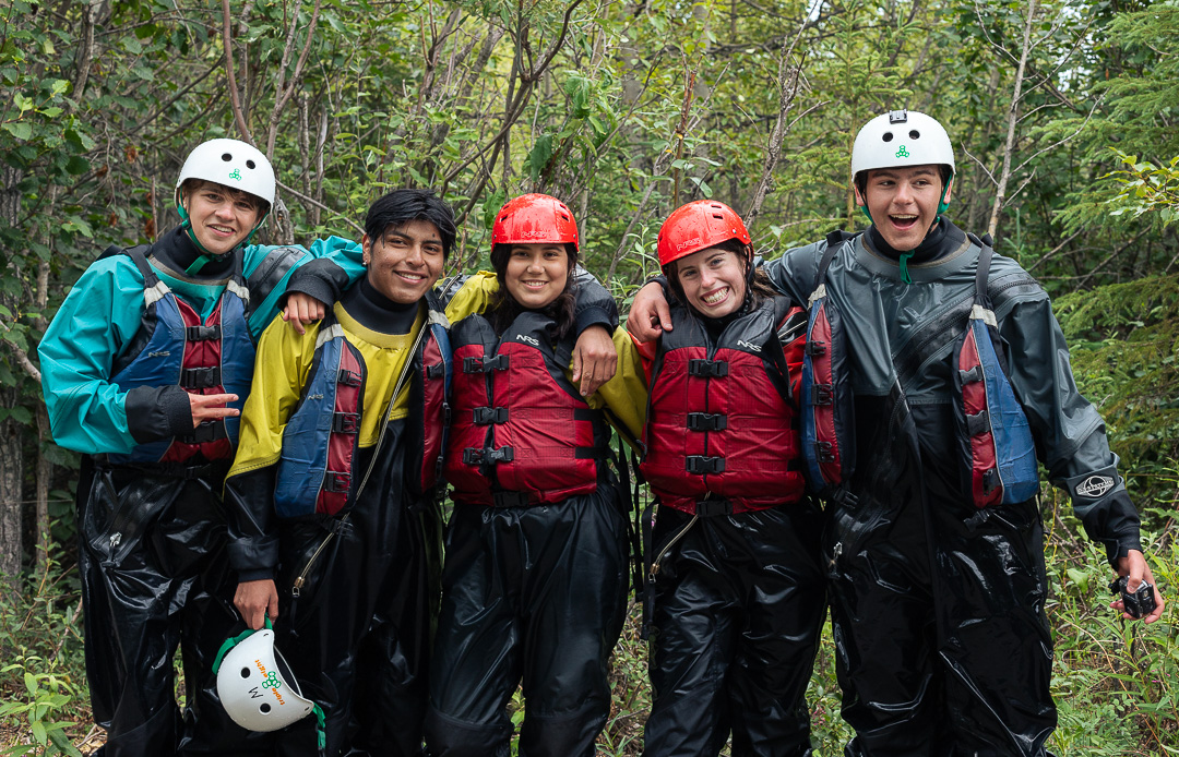 campers smiling in their whitewater gear