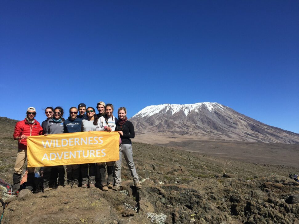 group photo in front of kilimanjaro