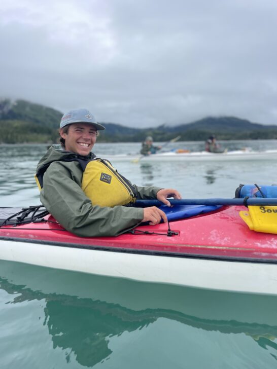 sea kayaker smiling in his kayak