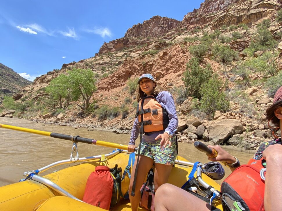 Person paddling whitewater raft in Utah