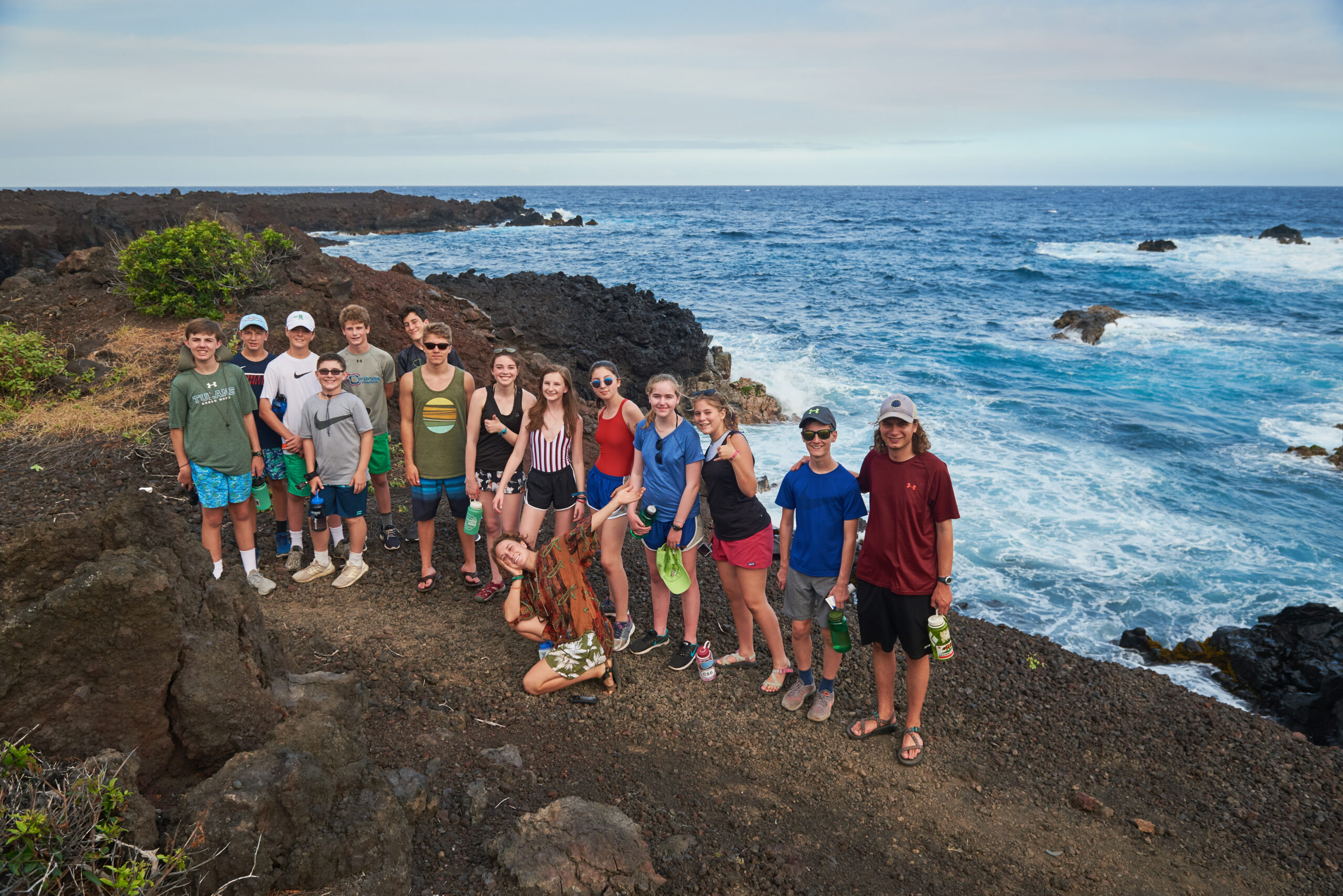group on a hike by the ocean in Hawaii