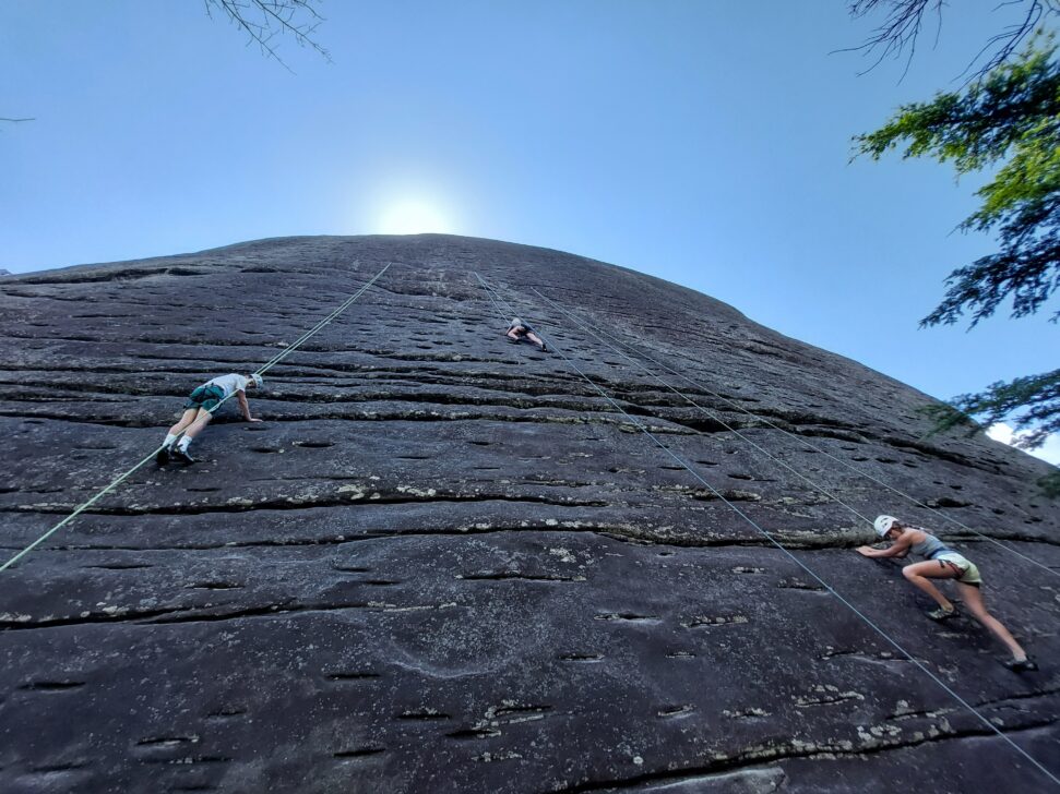 3 People Climbing at Looking Glass Rock
