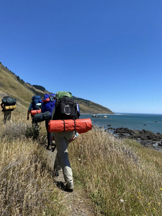 students backpacking along the lost coast