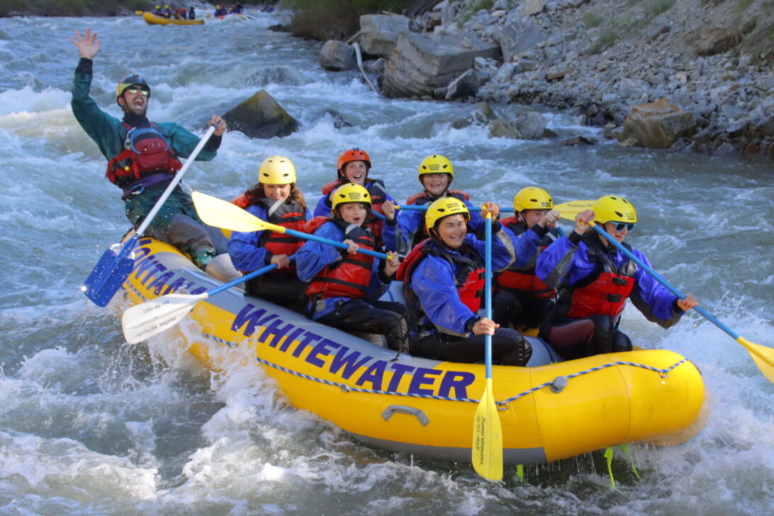 group of students whitewater rafting
