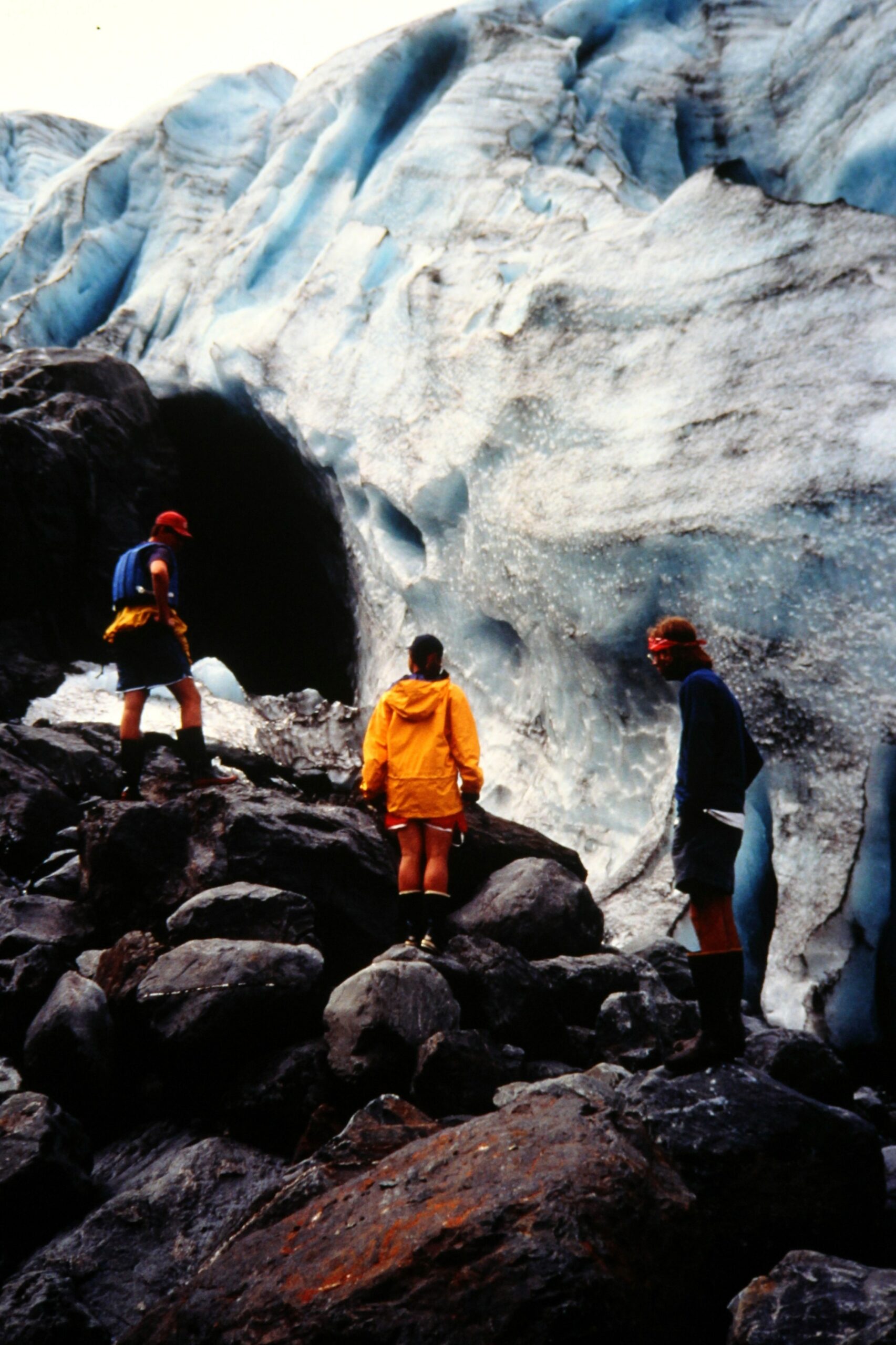 1993 Climbing on rock by glacier