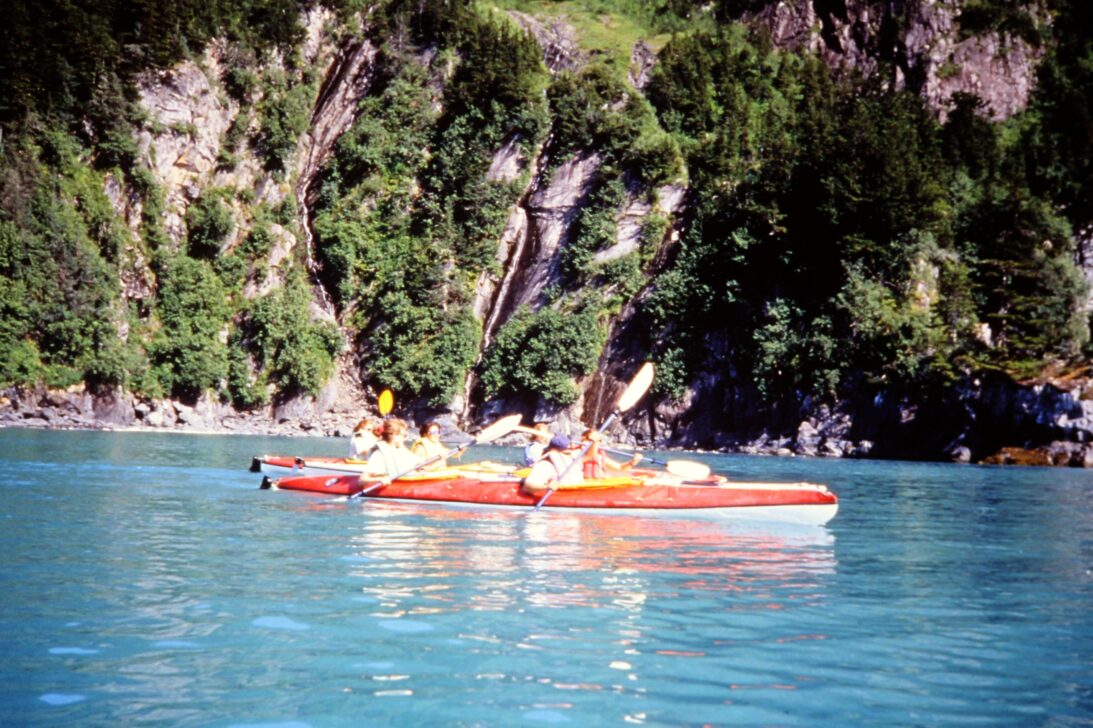 1993 Sea kayaking in bright blue water