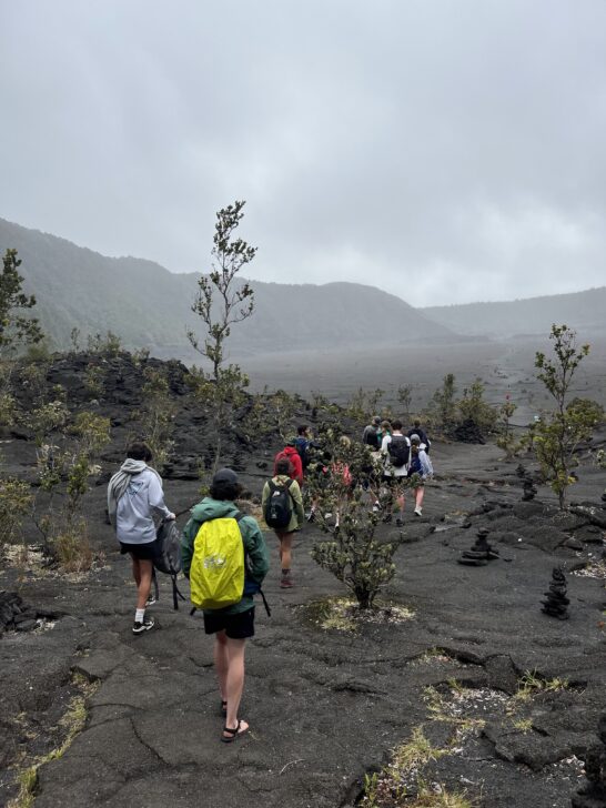 group hiking through Volcanoes National Park