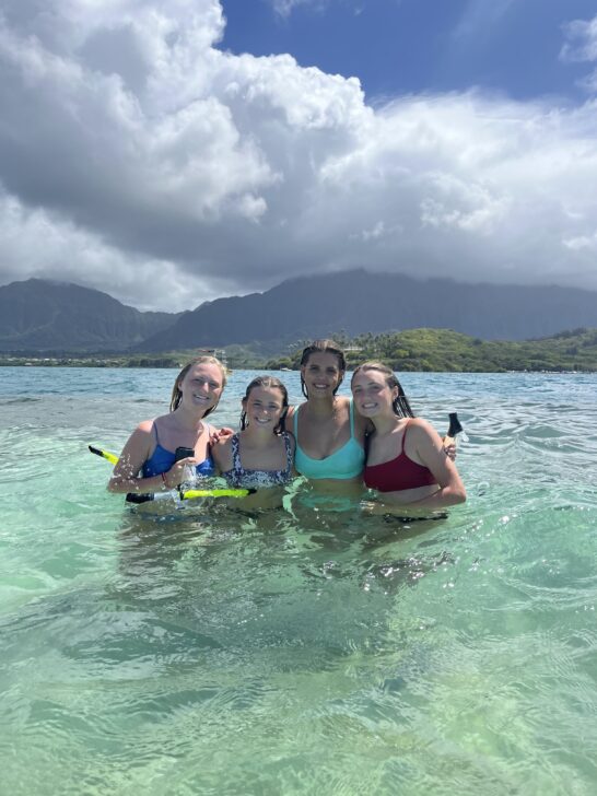 4 girls swimming in hawaii