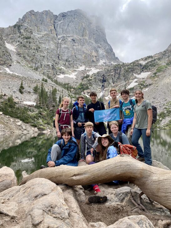 group of students posing in front of Emerald Lake in Rocky Mountain National Park