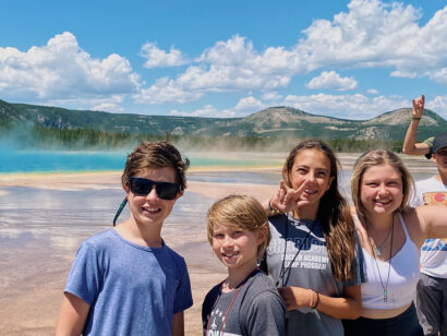 Group of students at Grand Prismatic Geyser in Yellowstone.