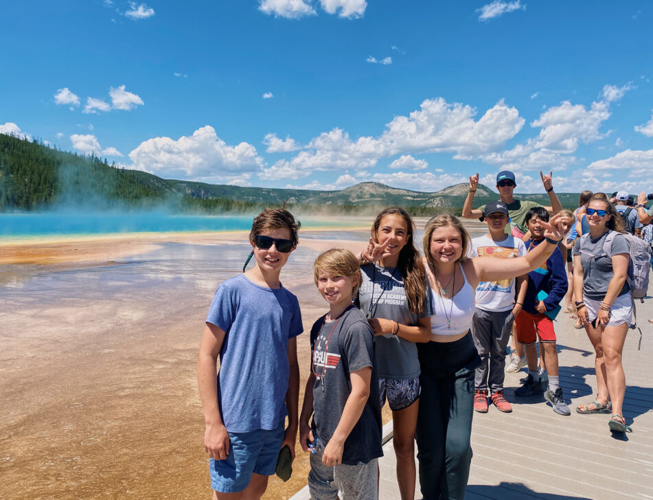 Group of students at Grand Prismatic Geyser in Yellowstone.