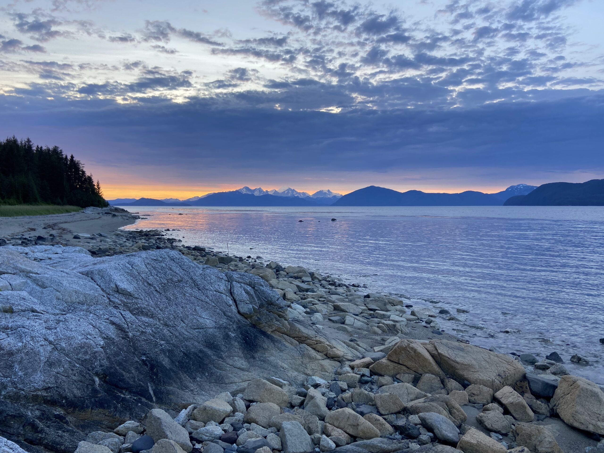 Colorful sunset over the shoreline of Alaska.